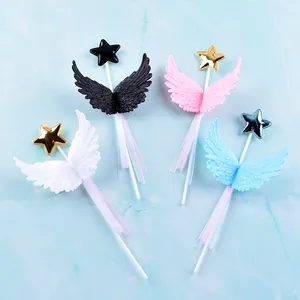 Set of four colorful 3D wing and star cake toppers with ribbons for birthday party decoration