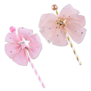 Pink and peach mesh bow fairy wand cake toppers with stars and striped sticks