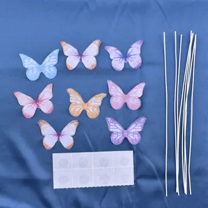 Detailed set of colorful fabric butterfly cake toppers with stems and adhesive dots