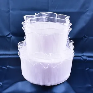 Close-up of white wavy tulle cake border decoration for birthday and wedding cakes