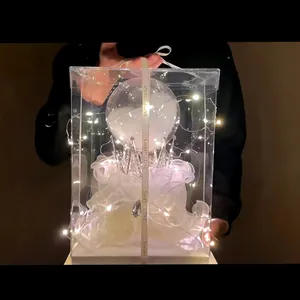 Dreamy crystal ball cake decoration ornament in transparent gift box with warm LED fairy lights