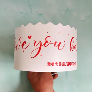 White Valentine's Day cake wrap with red 'Love you baby' text and Chinese script