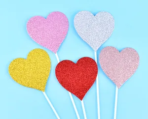 Glitter heart cake toppers in multiple colors for Valentine's Day party dessert decor
