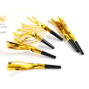 Detailed close-up of metallic gold foil fringe party blowouts for children's birthday celebrations.