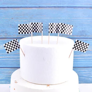 Detailed view of black and white checkered racing flags used for cake decoration