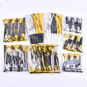 Assorted party blowouts in bulk packs with metallic gold and silver tinsel