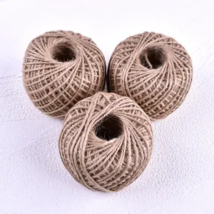 Close-up macro view of three rolls of natural brown jute twine for DIY baking packaging