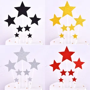 Glitter star cake topper set in gold, silver, red, and black for birthday party decor