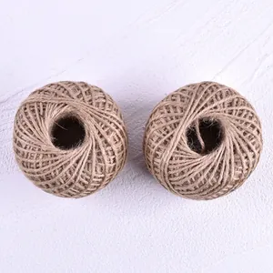 Macro detail of two rolls of natural brown jute twine used for DIY baking and craft packaging