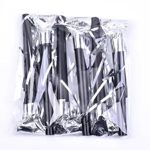 Close-up of black and silver party blowouts in transparent plastic packaging.