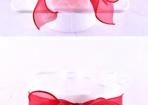Detail of red mesh cake ribbon decoration with elegant white pleated mesh texture
