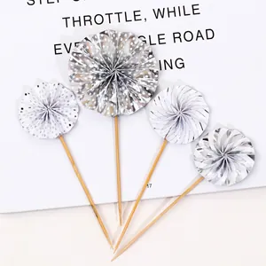 Set of four silver and white patterned paper fan cake toppers for birthday party decor