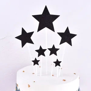 Set of seven black glitter star cake toppers for birthday party dessert table decorations