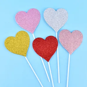 Assorted colorful glitter heart cake toppers for Valentine's Day and birthday party decor