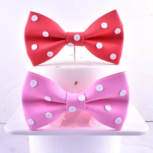 Decorative red and pink polka dot bow tie cake toppers for birthday party decorations