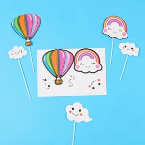 Set of colorful hot air balloon and smiling cloud cake toppers for birthday party decor