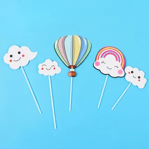 Cute rainbow and smiley cloud cake toppers with hot air balloon design for parties