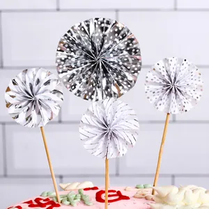 Set of 4 silver paper fan cake toppers with polka dots and stripes for birthday party decor.
