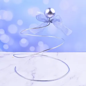Elegant silver spiral wire cake topper decoration with pearl and light blue fabric bow