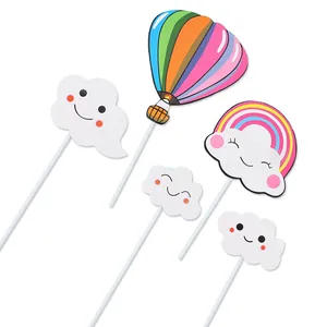 Detailed set of cute smiling cloud rainbow and hot air balloon cake toppers for birthdays