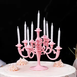 Elegant pink vintage plastic candelabra cake topper with nine white spiral candles.
