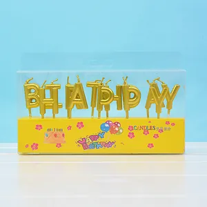 Goldene Happy Birthday Buchstabenkerzen in Verpackung für festliche Tortendekoration