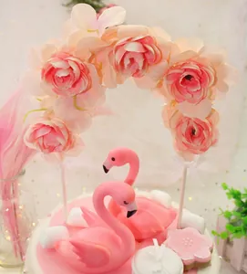Elegant pink flamingo cake topper set with rose flower arch for wedding party decor