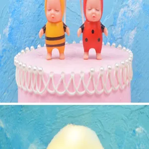 Detail view of a soft glowing cotton cloud lamp and cute bee and ladybug cake toppers