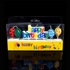 Colorful Happy Birthday letter candles with festive balloon shapes in clear display packaging