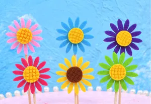 Colorful felt sunflower cake toppers for birthday party dessert table decoration