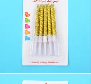 Detail shot of 10 gold-plated spiral birthday candles in white retail packaging.