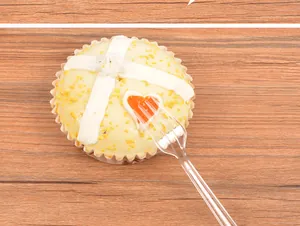 Single-use transparent plastic dessert fork for fruits and pastries detail view
