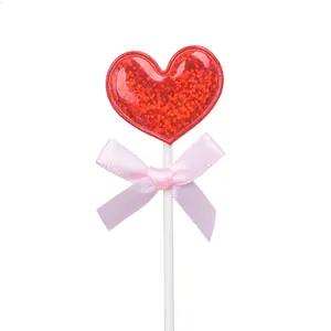 Decoración de pastel con corazón brillante rojo y lazo rosa para fiesta de cumpleaños