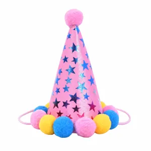 Detail of a pink pet birthday party hat with pom-poms and dimensions 11cm by 9cm.