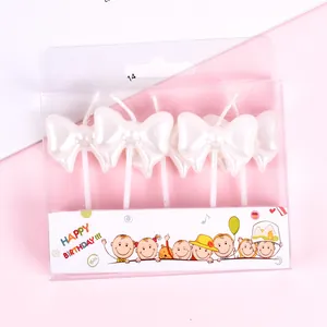 White pearl bow-shaped birthday candles set of 5 in decorative box for cake decoration