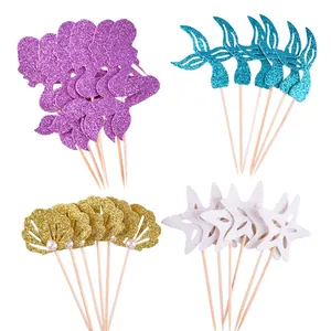 Detail view of 24 glitter mermaid and seashell cake toppers for party decoration