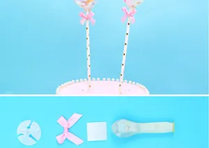 Detailed view of 5-inch confetti balloon cake topper kit with pink ribbon and stick