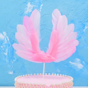 Elegant pink feather angel wing cake topper for birthday and wedding decorations