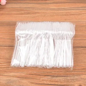 Pack of 100 disposable transparent plastic forks for desserts, cakes, and fruits