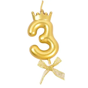 Elegant gold number 3 birthday candle with mini crown and glittery bow knot