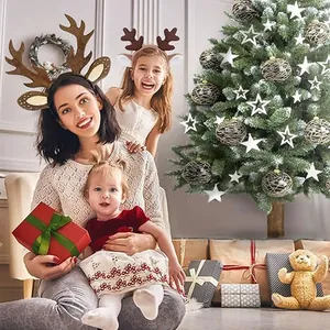 Family wearing festive reindeer antler headbands in a warm Christmas living room