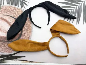 Close-up of black and ginger plush rabbit ear headbands for Halloween cosplay accessories
