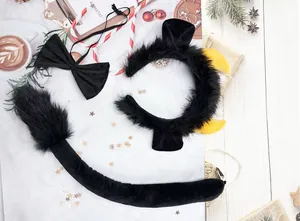 Plush black animal cosplay accessory set including furry headband, bowtie, and tail