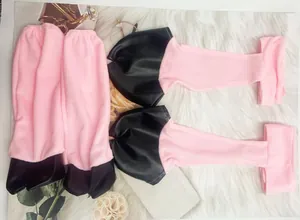 Detailed view of pink and black plush leg covers for Halloween animal costume sets