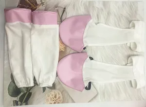 Detail view of pink and white plush horse donkey costume sleeves and foot covers for Halloween