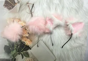 Pink furry cat ears headband presented on a soft white plush background for Lolita cosplay.