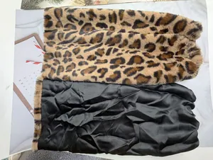 Close-up of leopard print faux fur fabric and smooth black satin lining detail