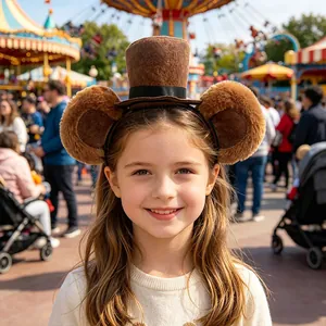 Cute brown plush bear ear headband with mini top hat worn by a smiling young girl