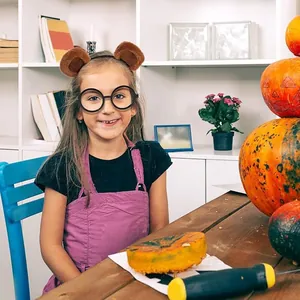 Young girl wearing cute brown plush panda ear headband in a festive indoor setting