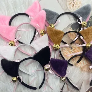 A collection of colorful plush cat ear headbands featuring pink bows and golden bells